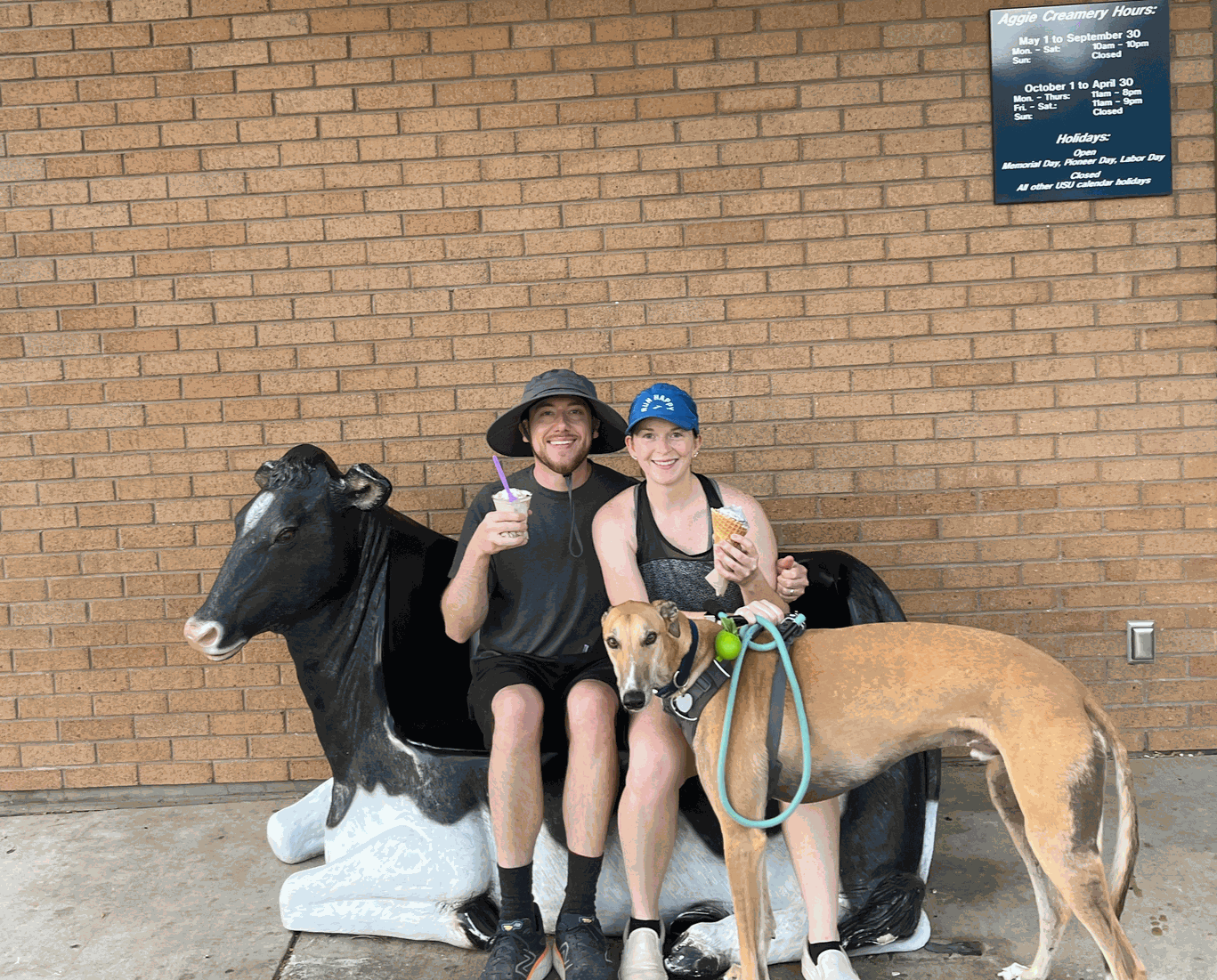 A photo of me, my partner Sarah, and my dog Winston outside of Aggie Creamery in Logan, Utah